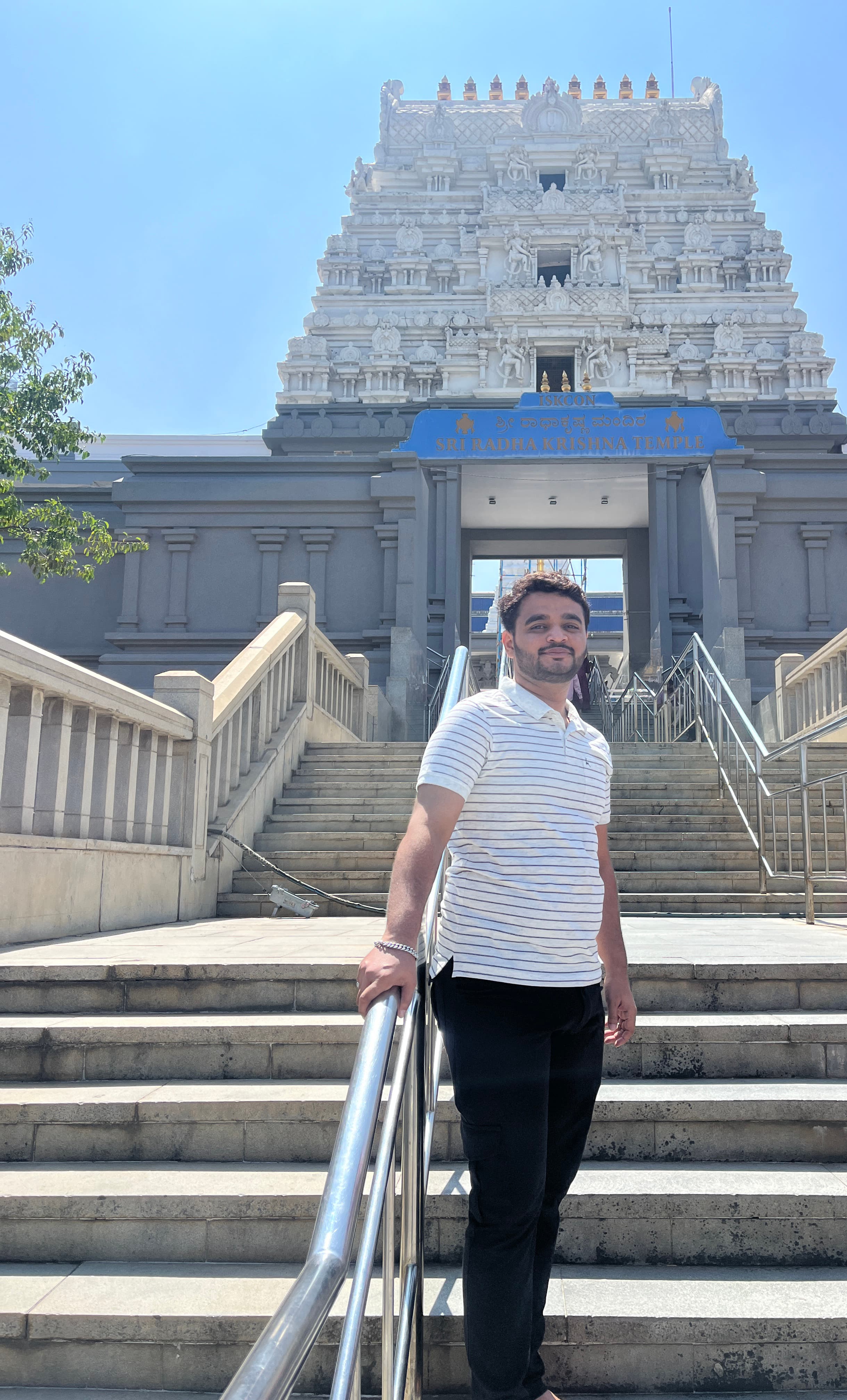 Standing on the steps of the ISKCON temple complex in Bangalore